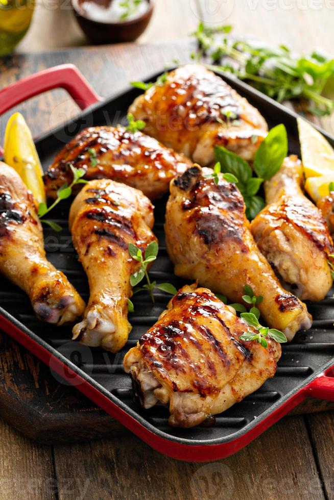 Grilled chicken thighs and drumsticks with honey glaze photo