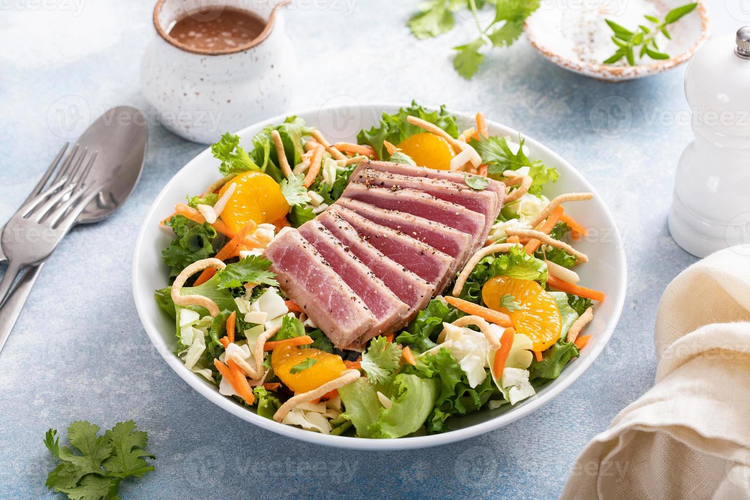 Seared tuna with asian crunchy salad with oranges photo