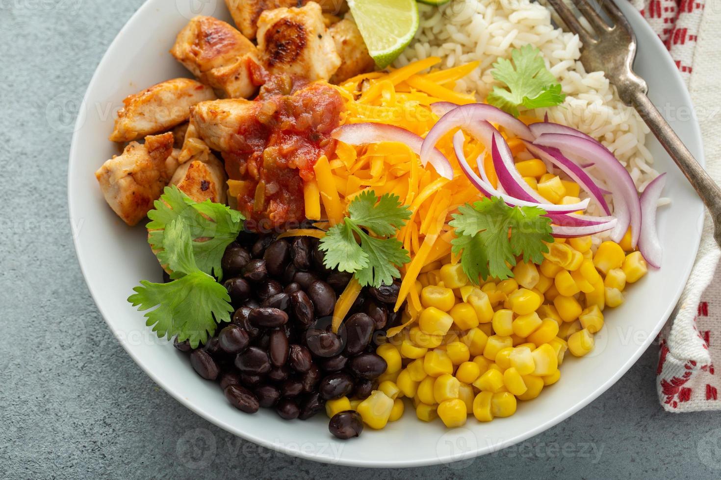 Mexican burrito bowl with salsa chicken and beans photo