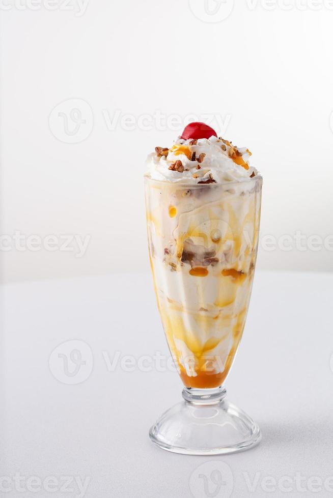 Caramel pecan ice cream sundae photo