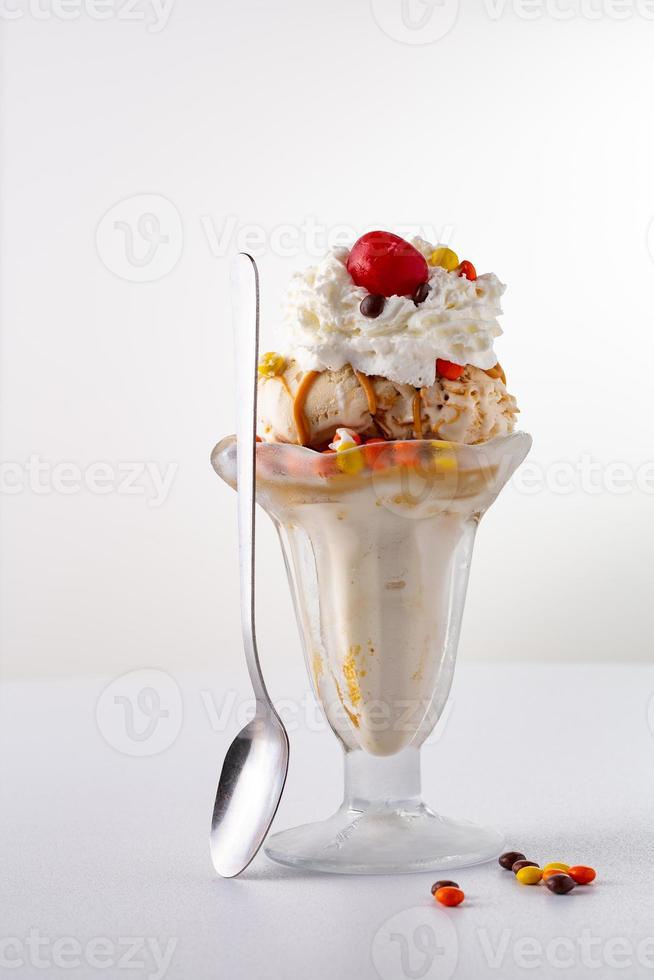 Caramel and peanut butter sundae photo