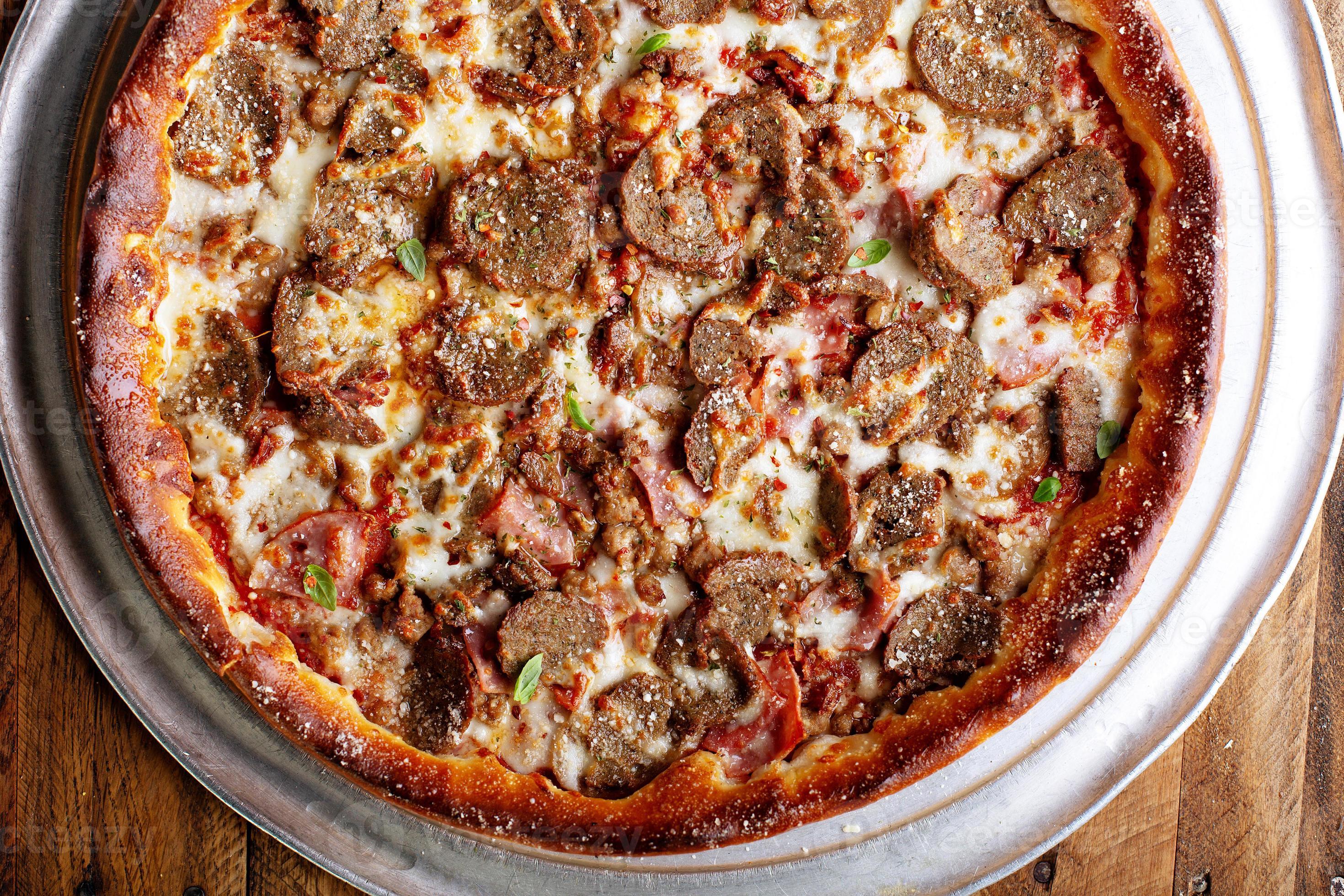 Deep dish meat pizza 16118911 Stock Photo at Vecteezy