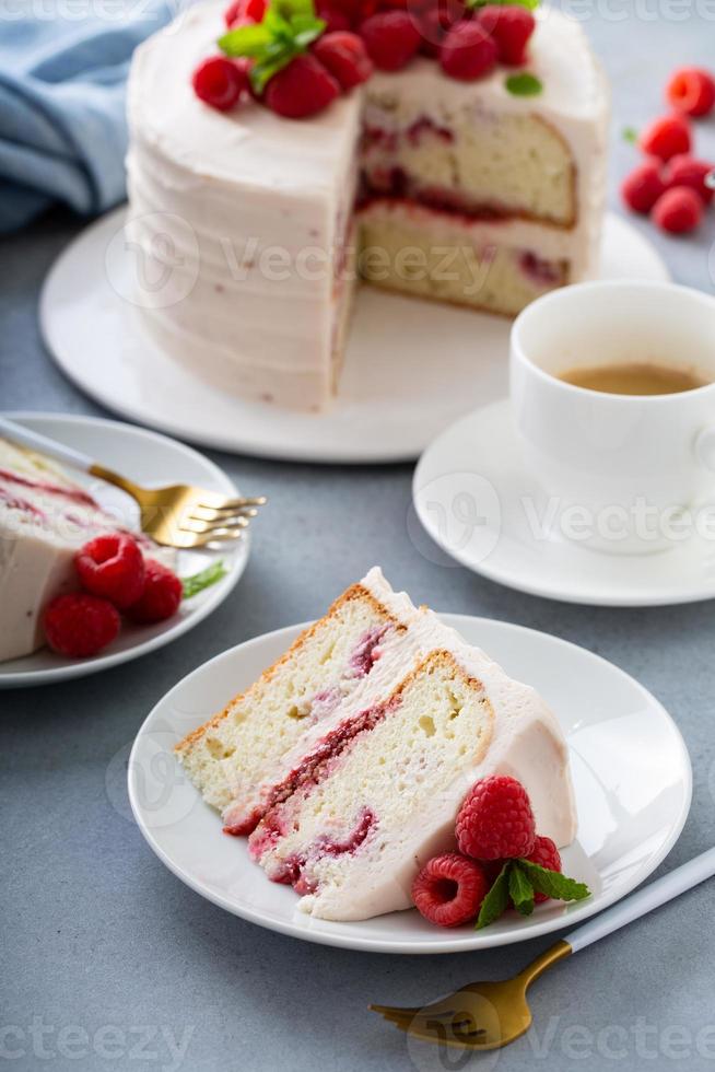 Respberry cake with light mascarpone frosting and fresh berries photo