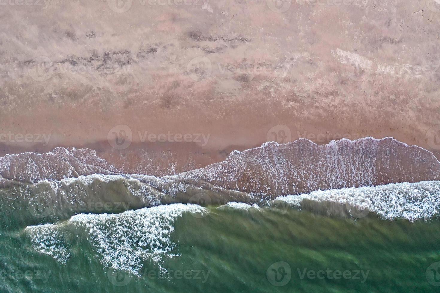 Aerial view of waves crashing on the beach in Brooklyn, New York. photo