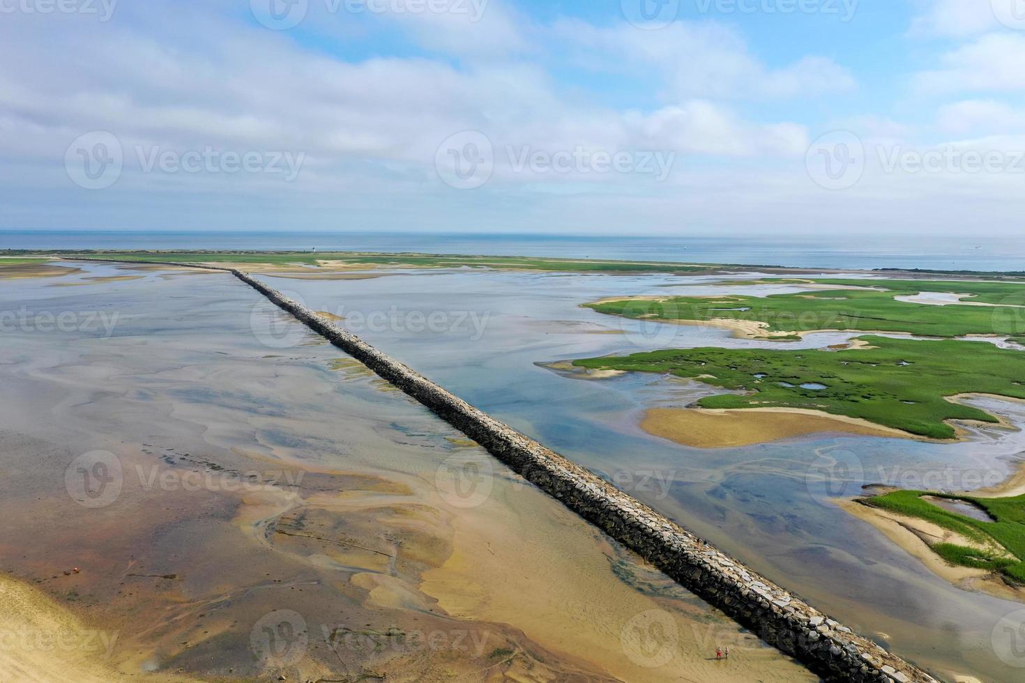 Provincetown Causeway also known as the Breakwater Walk, is an uneven collection of rocks that allows hikers to cross the harbor and reach the very tip of the Cape. photo