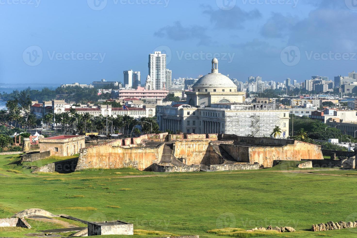 Puerto Rico Capitol and Castillo de San Cristobal, San Juan, Puerto Rico. Castillo de San Cristobal is designated as UNESCO World Heritage Site since 1983. photo