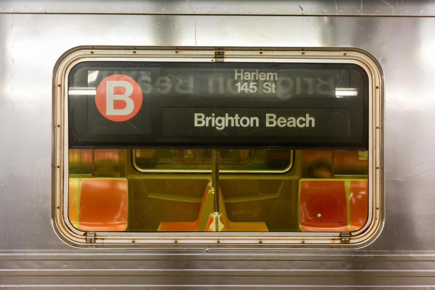 Brooklyn, New York - March 24, 2017 -  New York City subway train traveling between Brighton Beach, Brooklyn and Harlem 145 St, Manhattan. photo