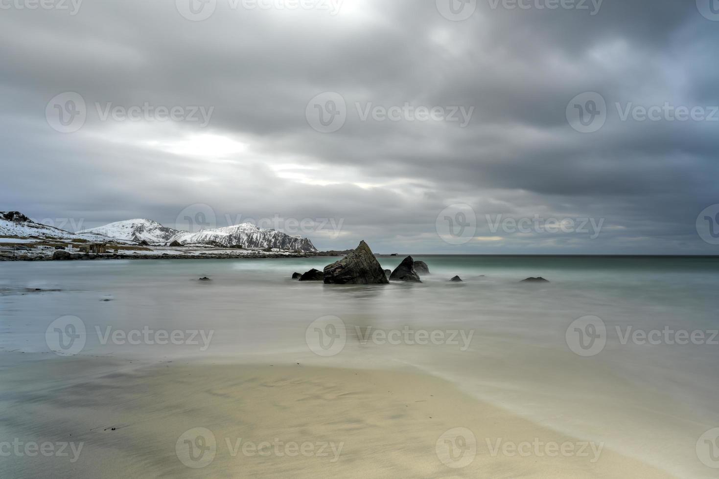 Skagsanden Beach in the Lofoten Islands, Norway in the winter on a cloudy day. photo