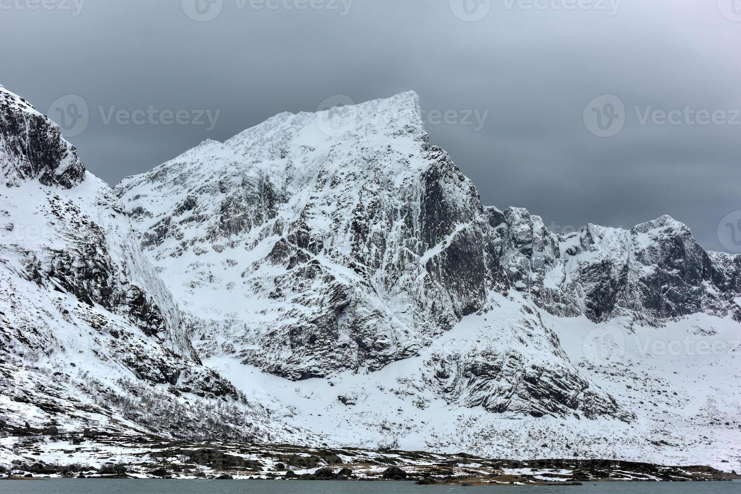 Flakstadoya in the Lofoten Islands, Norway in the winter on a cloudy day. photo