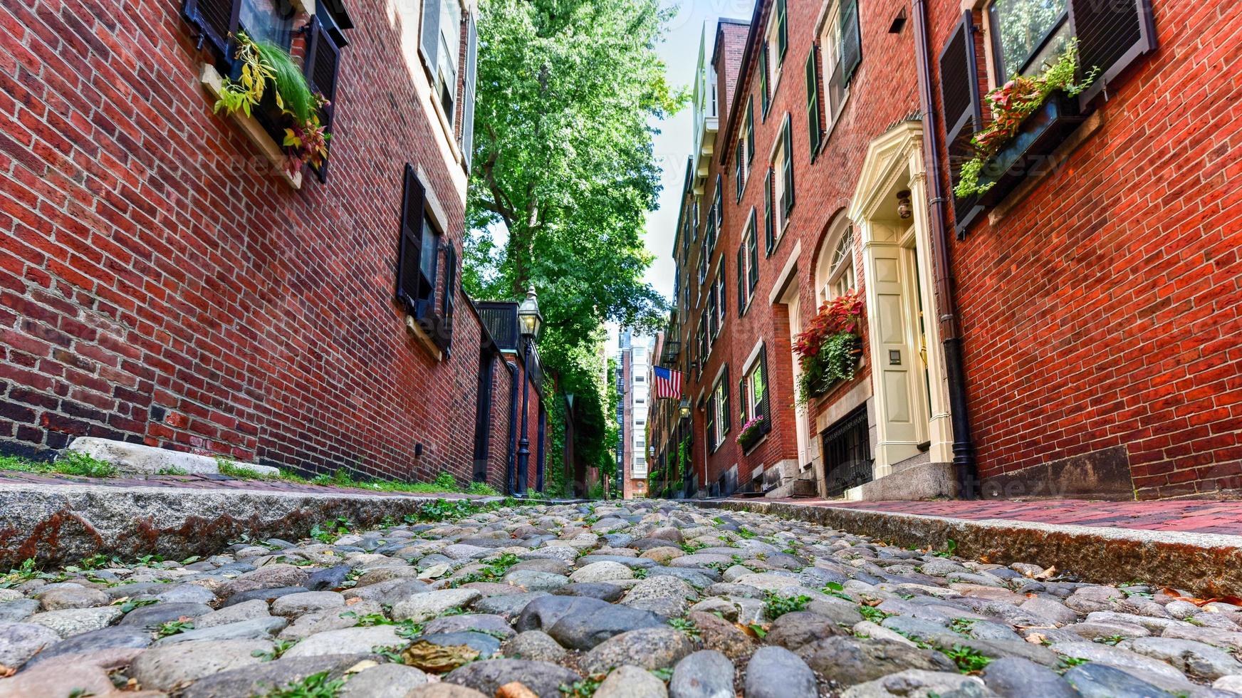 Acorn Street in Boston, Massachusetts. It is a narrow lane paved with cobblestones that was home to coachmen employed by families in Mt. Vernon and Chestnut Street mansions. photo