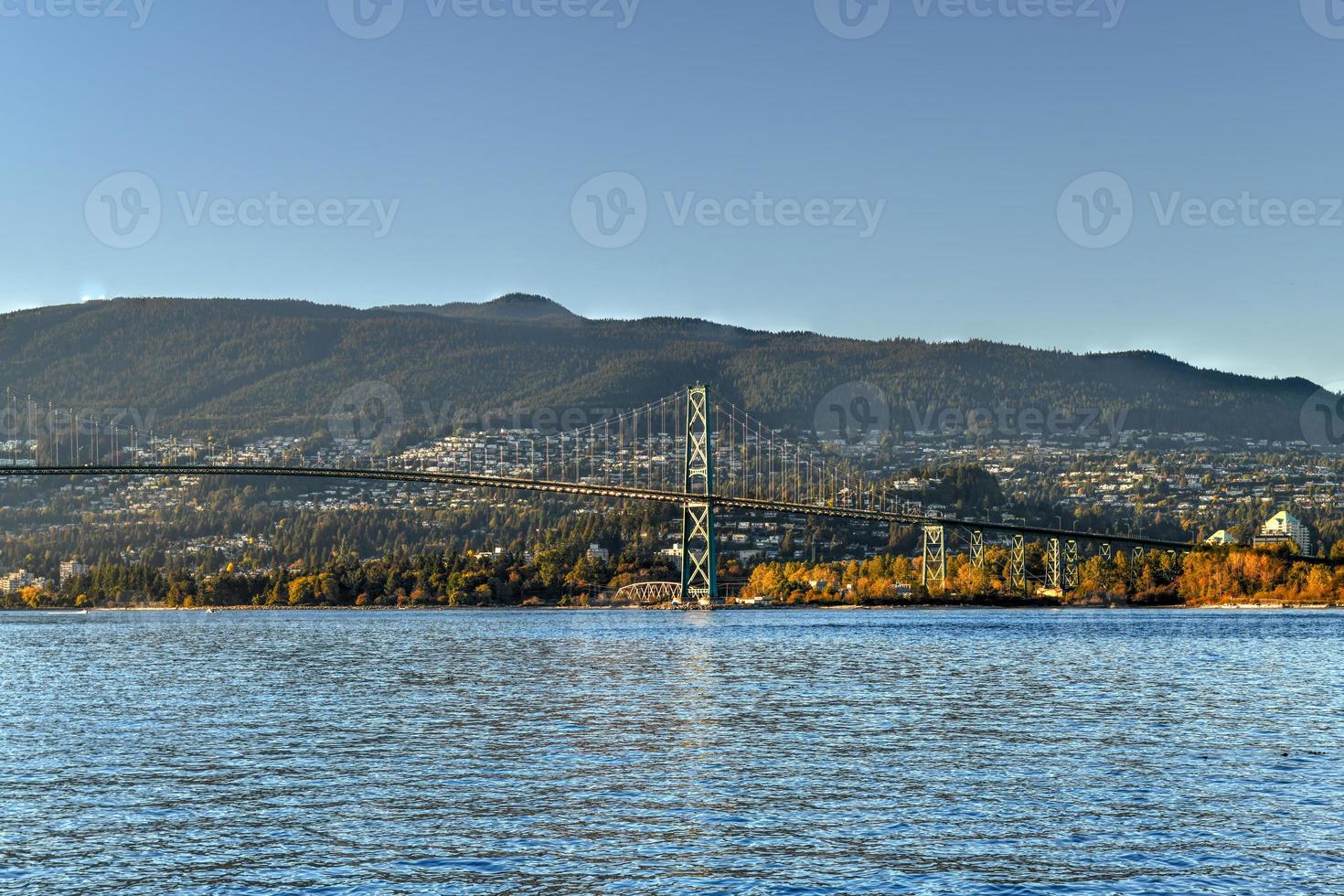 Lions Gate Bridge as seen from Stanley Park in  Vancouver, Canada. The Lions Gate Bridge, opened in 1938, officially known as the First Narrows Bridge, is a suspension bridge. photo