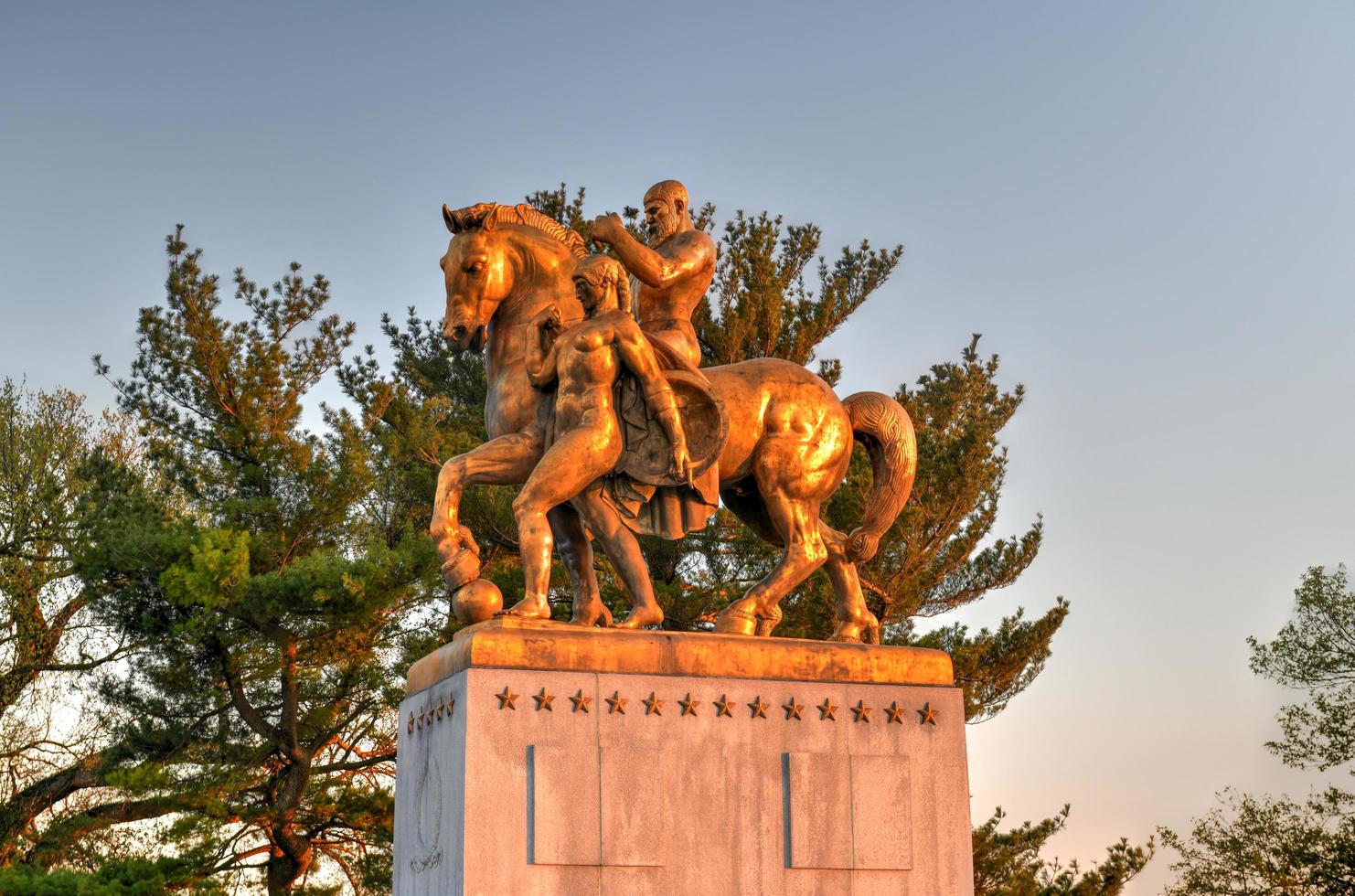 Washington, DC - Apr 4, 2021 -  Arts of War, bronze, fire-gilded statue groups on Lincoln Memorial Circle in West Potomac Park at sunset in Washington, DC photo