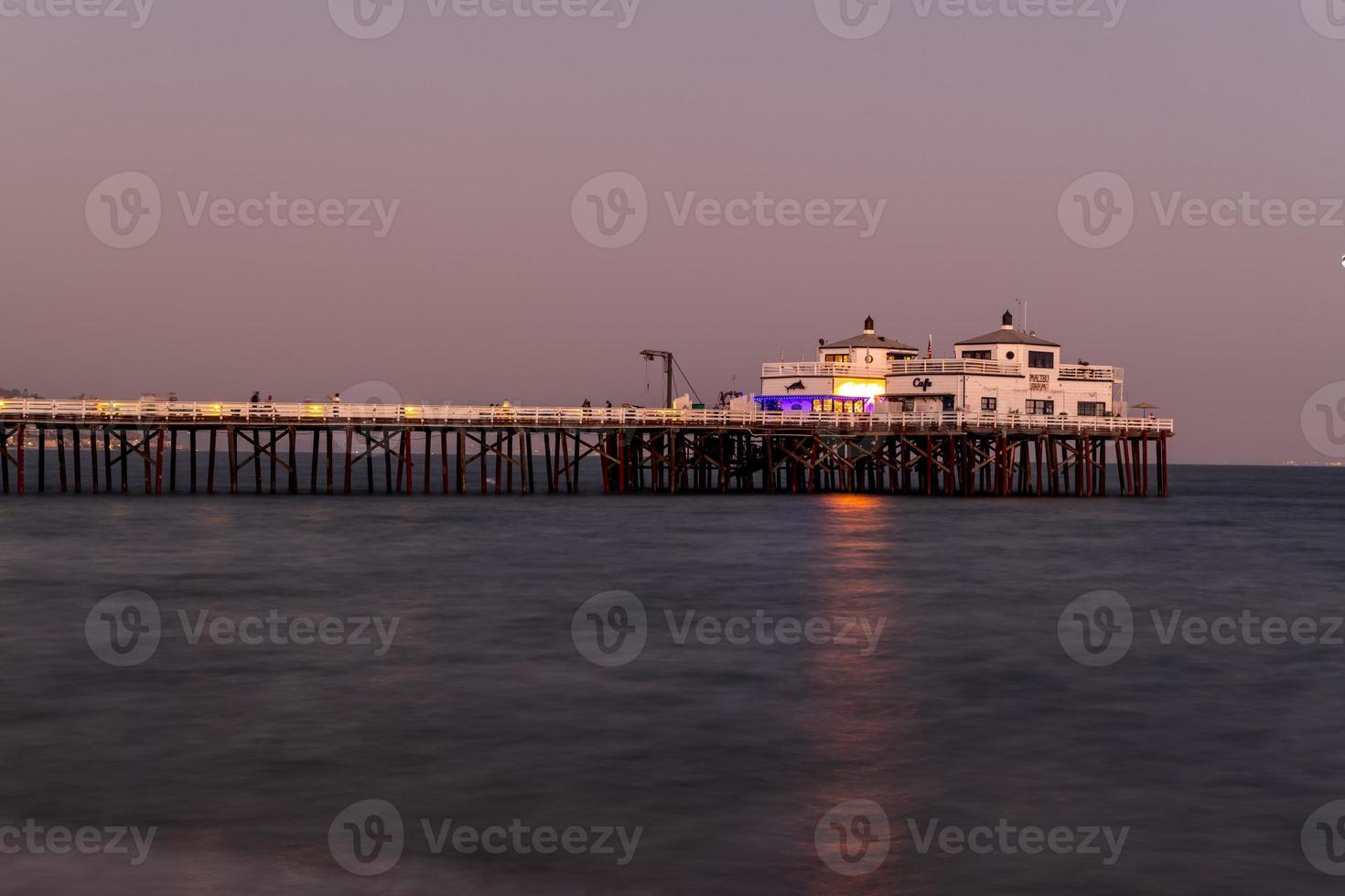 Malibu, California - Aug 27, 2020 -  Malibu Pier along Malibu Beach at sunset in Malibu, California. photo