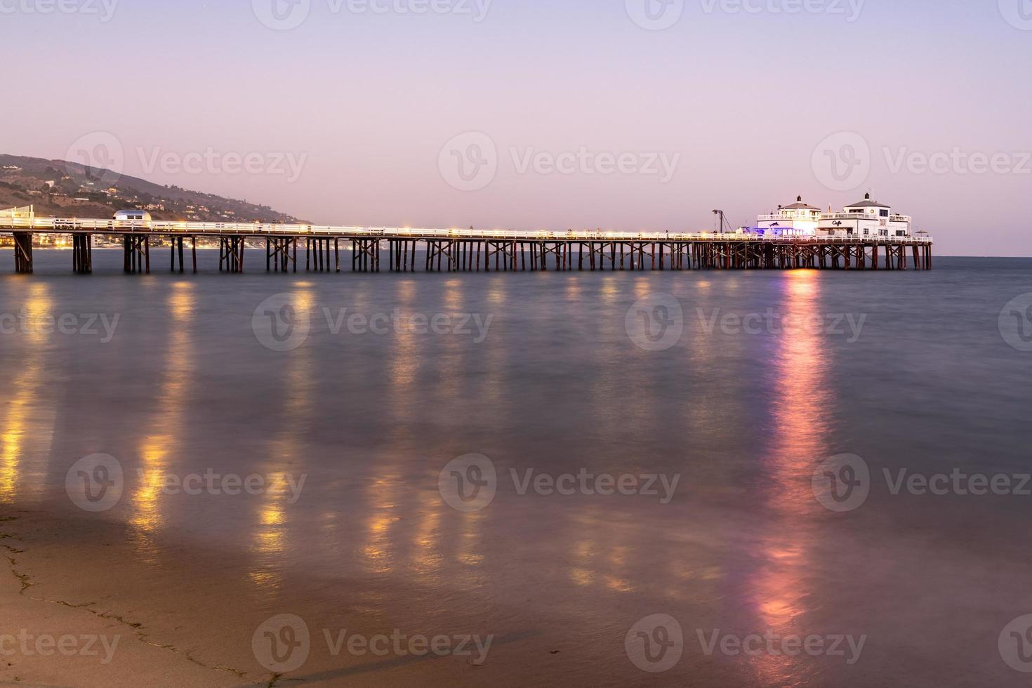 Malibu, California - Aug 27, 2020 -  Malibu Pier along Malibu Beach at sunset in Malibu, California. photo