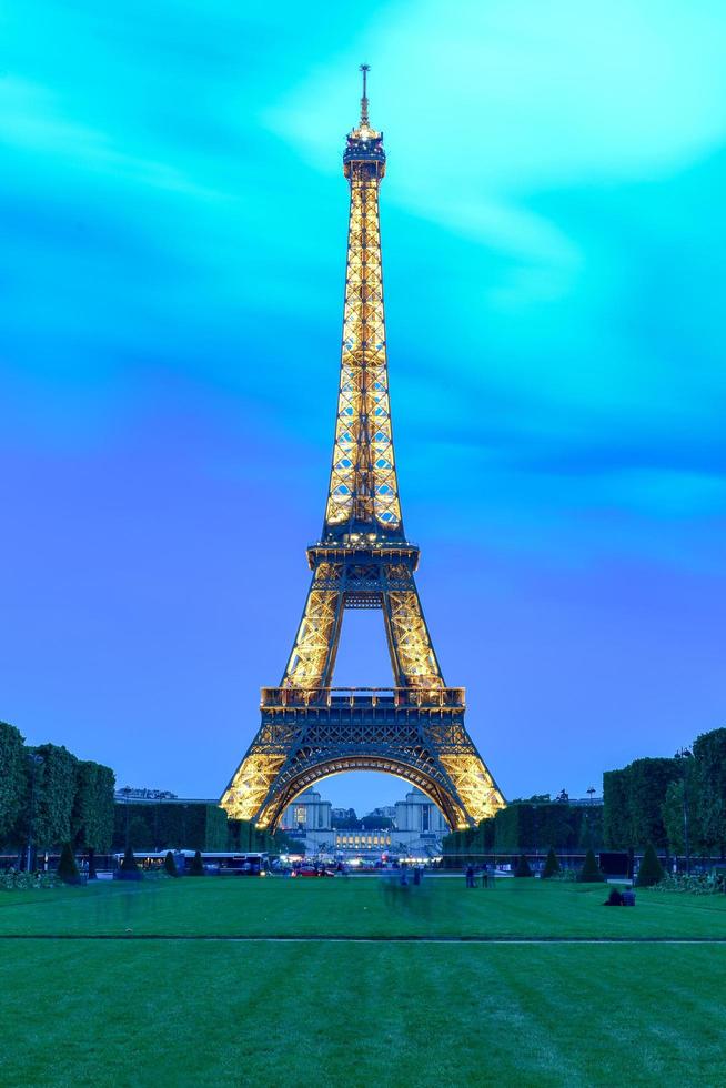 The iconic Eiffel Tower on a drizzly evening from the Champ de Mars in Paris, France, 2022 photo