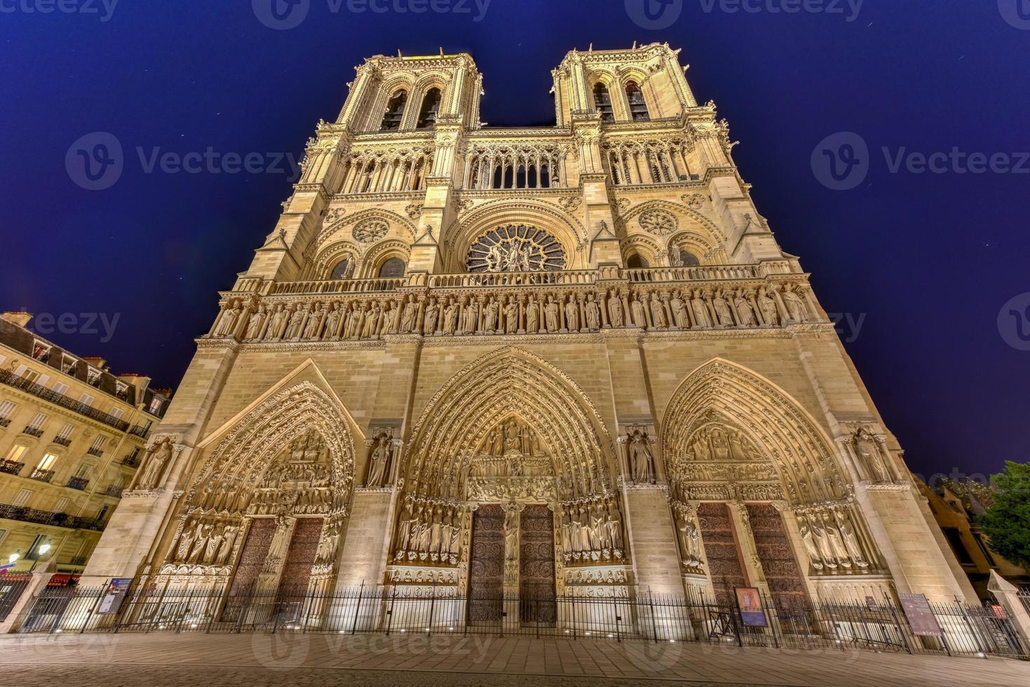 Notre-Dame de Paris, is a French Gothic medieval Catholic cathedral on the Ile de la Cite in the fourth arrondissement of Paris, France. photo