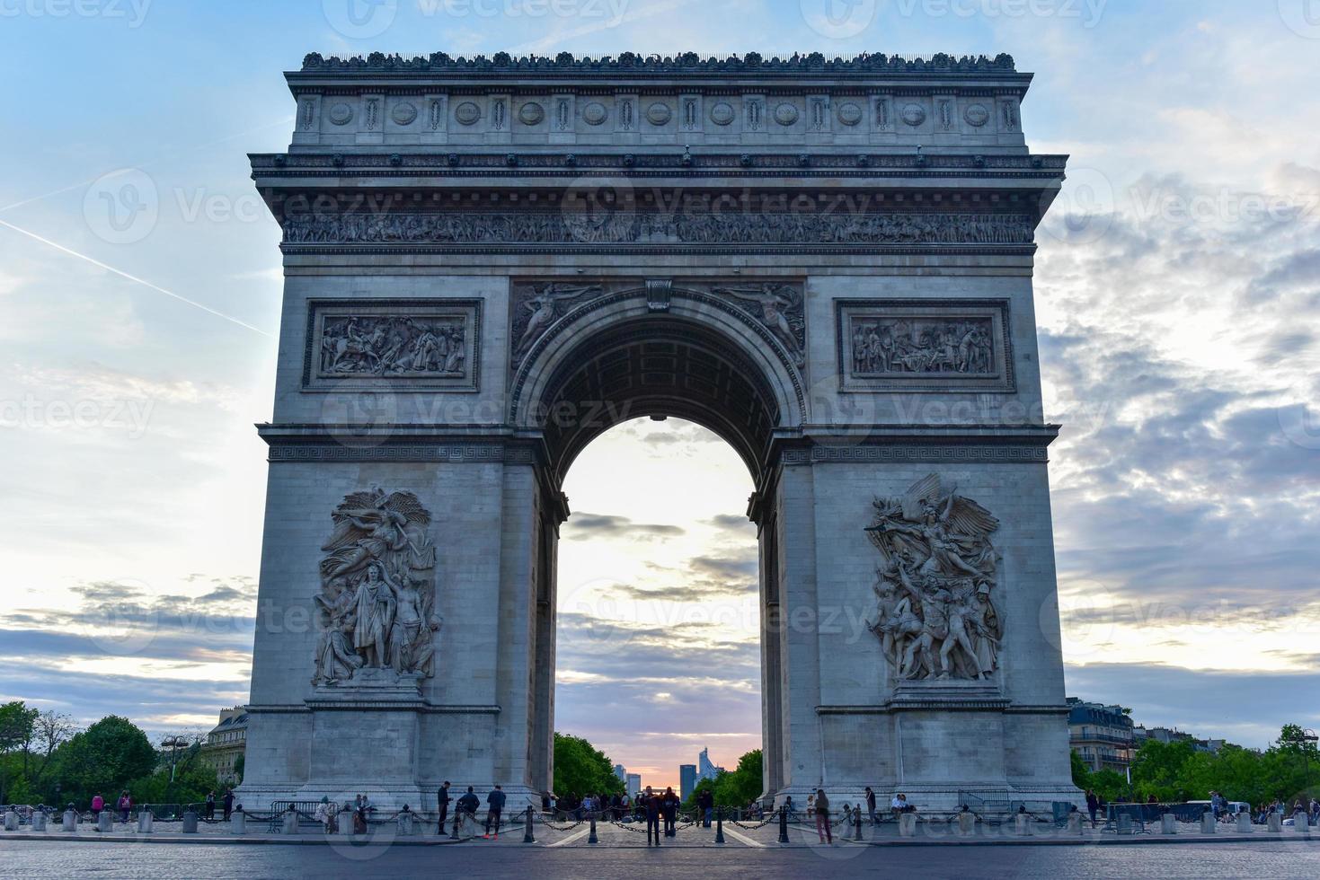 The Arc de Triomphe de l'Etoile, is one of the most famous monuments in Paris, standing at the western end of the Champs-elysees at the center of Place Charles de Gaulle. photo