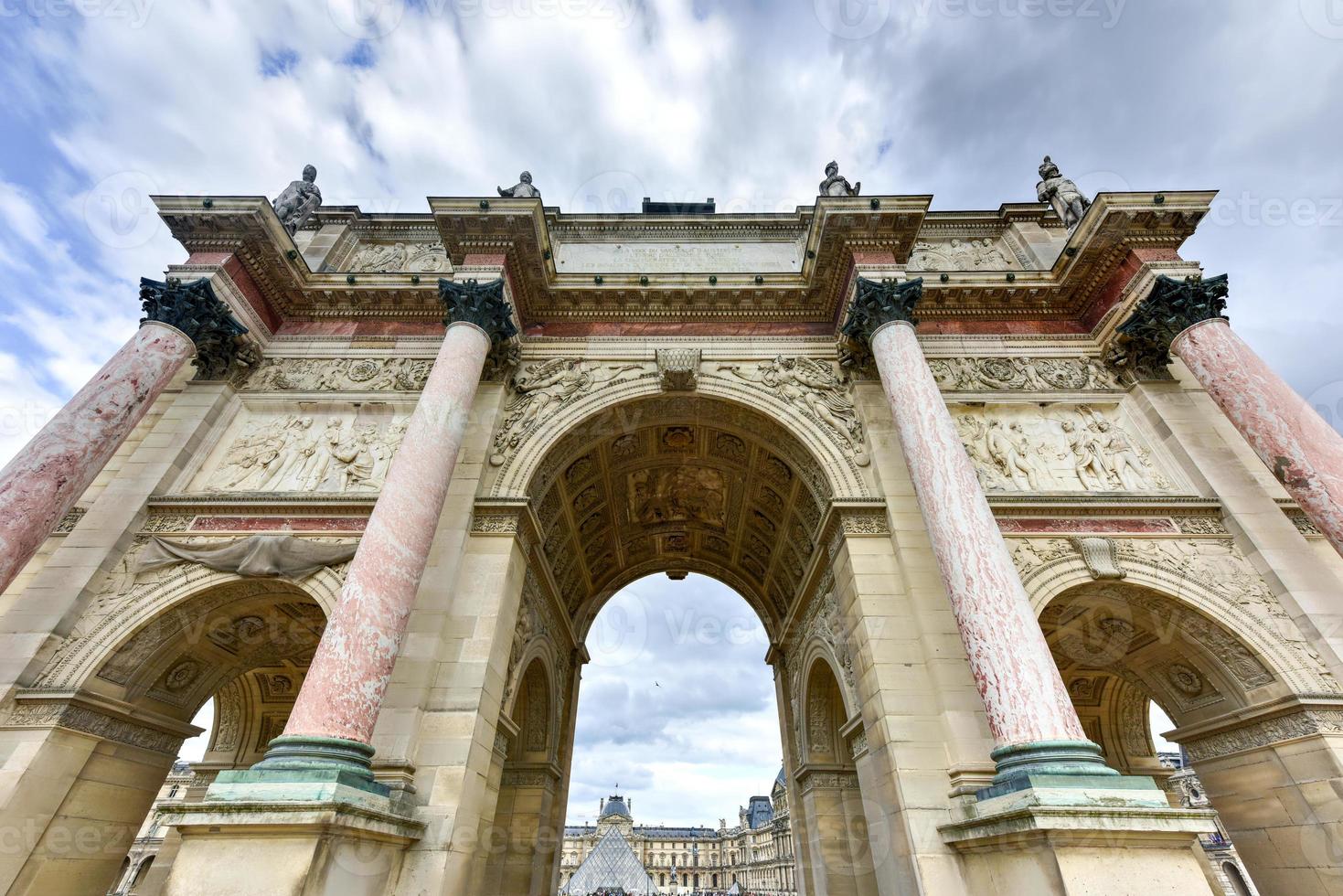 Triumphal Arch at Tuileries gardens in Paris, France. Monument was built between 1806-1808 to commemorate Napoleon's military victories. photo