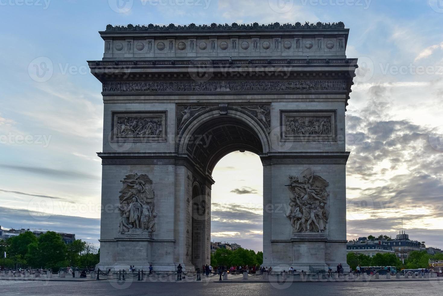 The Arc de Triomphe de l'Etoile, is one of the most famous monuments in Paris, standing at the western end of the Champs-elysees at the center of Place Charles de Gaulle. photo
