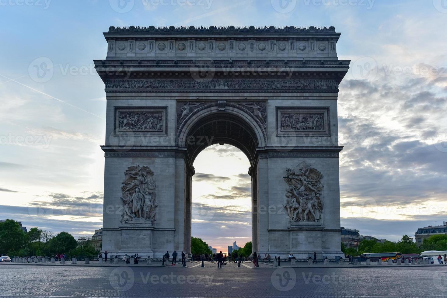 The Arc de Triomphe de l'Etoile, is one of the most famous monuments in Paris, standing at the western end of the Champs-elysees at the center of Place Charles de Gaulle. photo