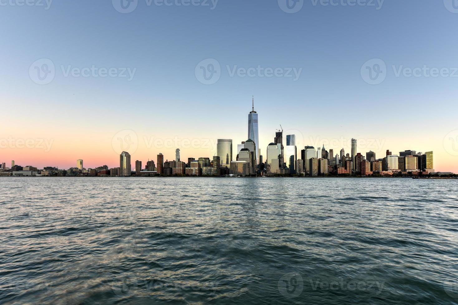 New York skyline as viewed across the Hudson River in New Jersey at sunset. photo
