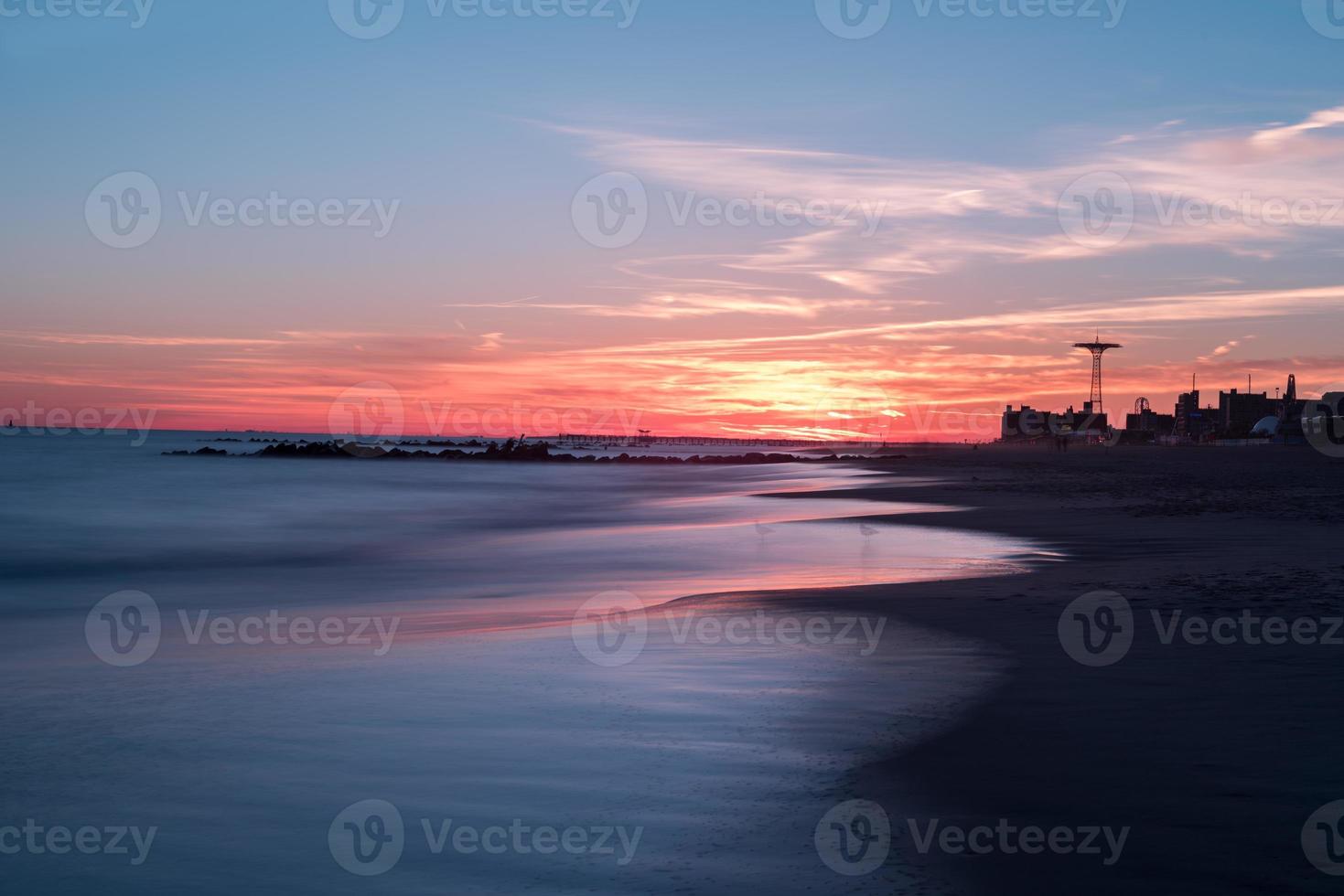Sunset on Coney Island Beach in Brooklyn, New York. photo