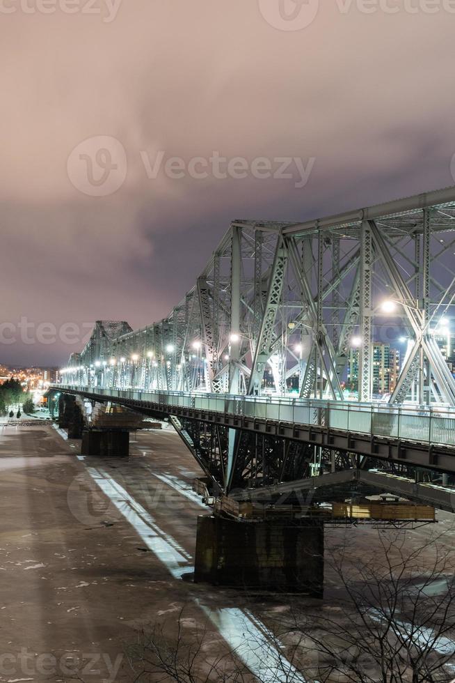 Alexandra Bridge at night connecting Quebec and Ontario, Gatineau and Ottawa in Canada. photo