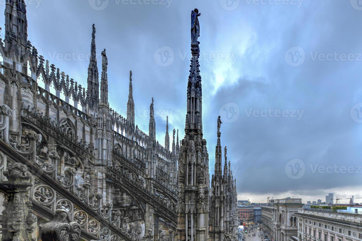 Milan Cathedral, Duomo di Milano, one of the largest churches in the world, on Piazza Duomo square in the Milan city center in Italy. photo