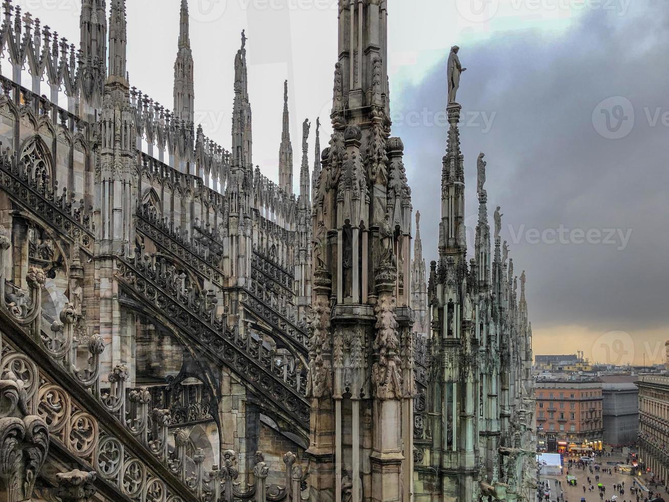 Milan Cathedral, Duomo di Milano, one of the largest churches in the world, on Piazza Duomo square in the Milan city center in Italy. photo