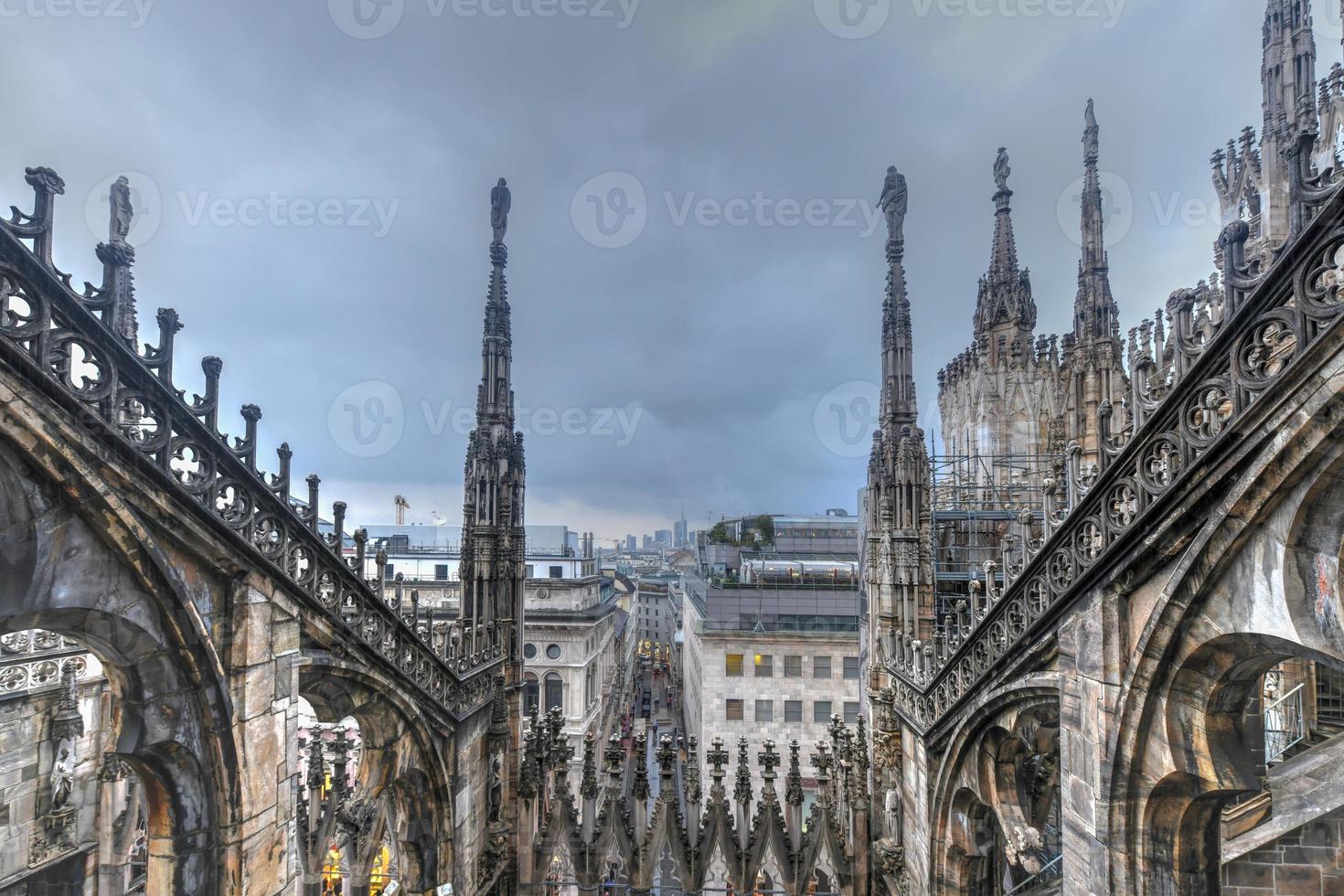 Milan Cathedral, Duomo di Milano, one of the largest churches in the world, on Piazza Duomo square in the Milan city center in Italy. photo