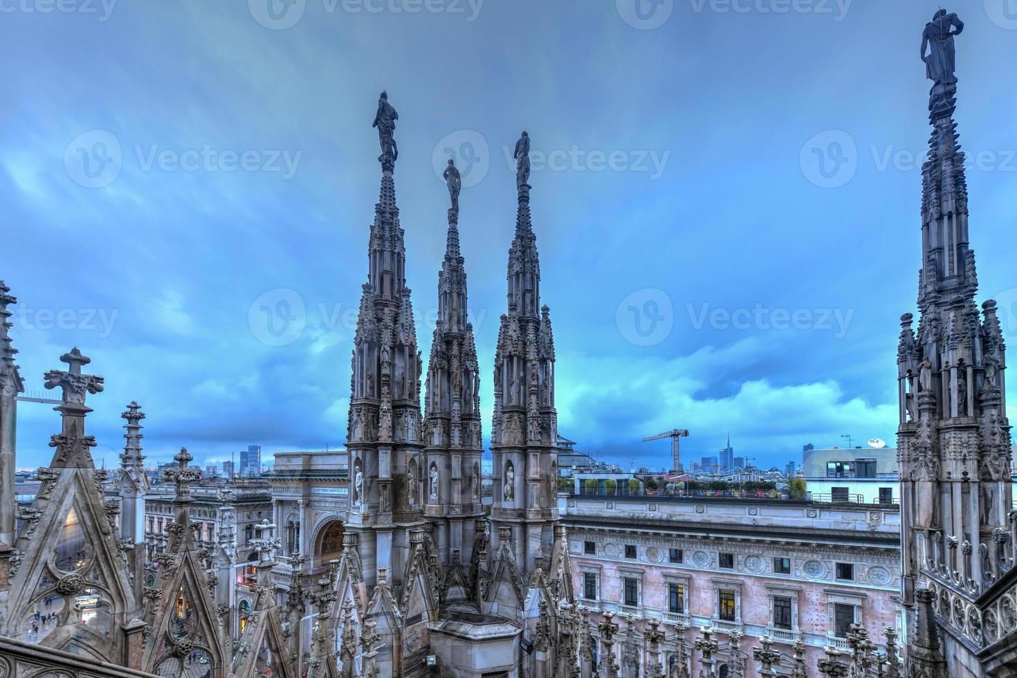 Milan Cathedral, Duomo di Milano, one of the largest churches in the world, on Piazza Duomo square in the Milan city center in Italy. photo