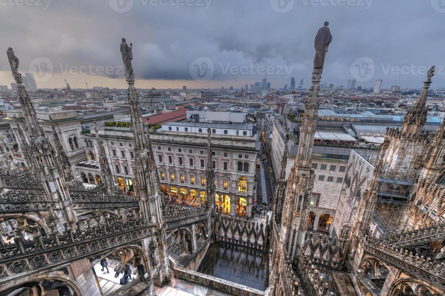 Milan Cathedral, Duomo di Milano, one of the largest churches in the world, on Piazza Duomo square in the Milan city center in Italy. photo
