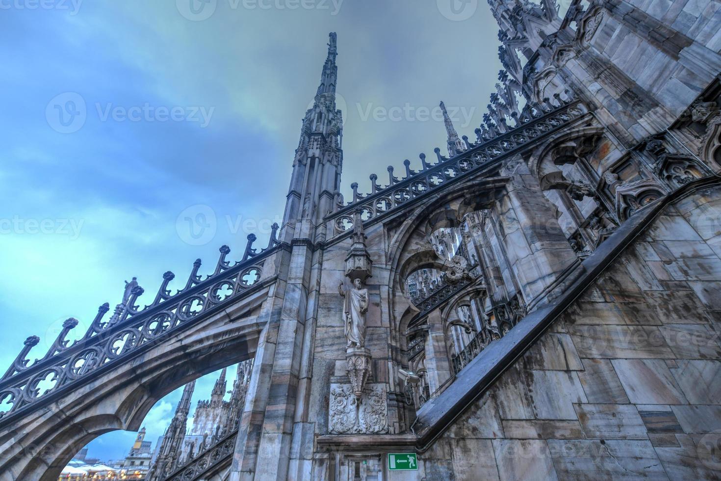 Milan Cathedral, Duomo di Milano, one of the largest churches in the world, on Piazza Duomo square in the Milan city center in Italy. photo