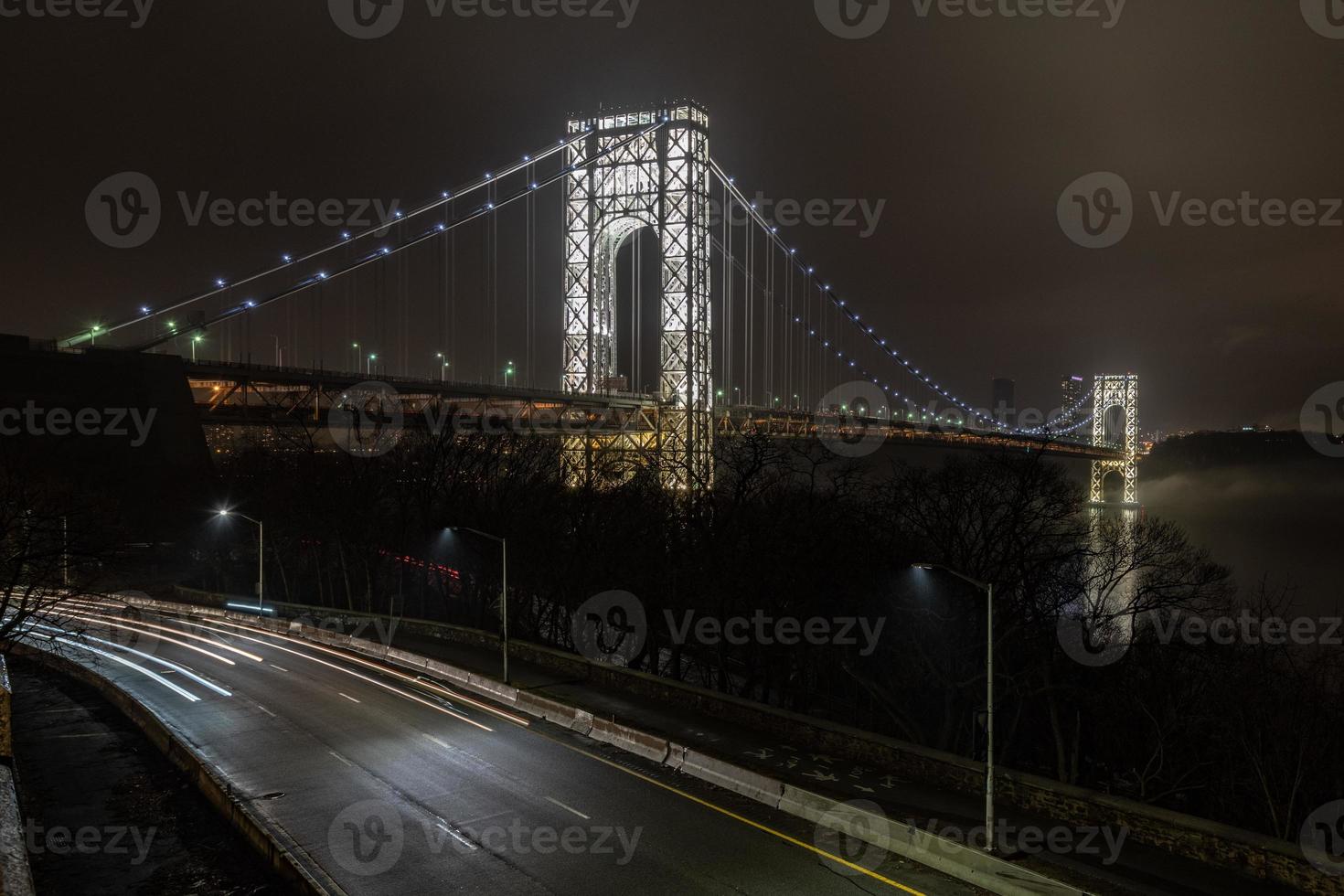 George Washington Bridge fully illuminated at night from New York City photo
