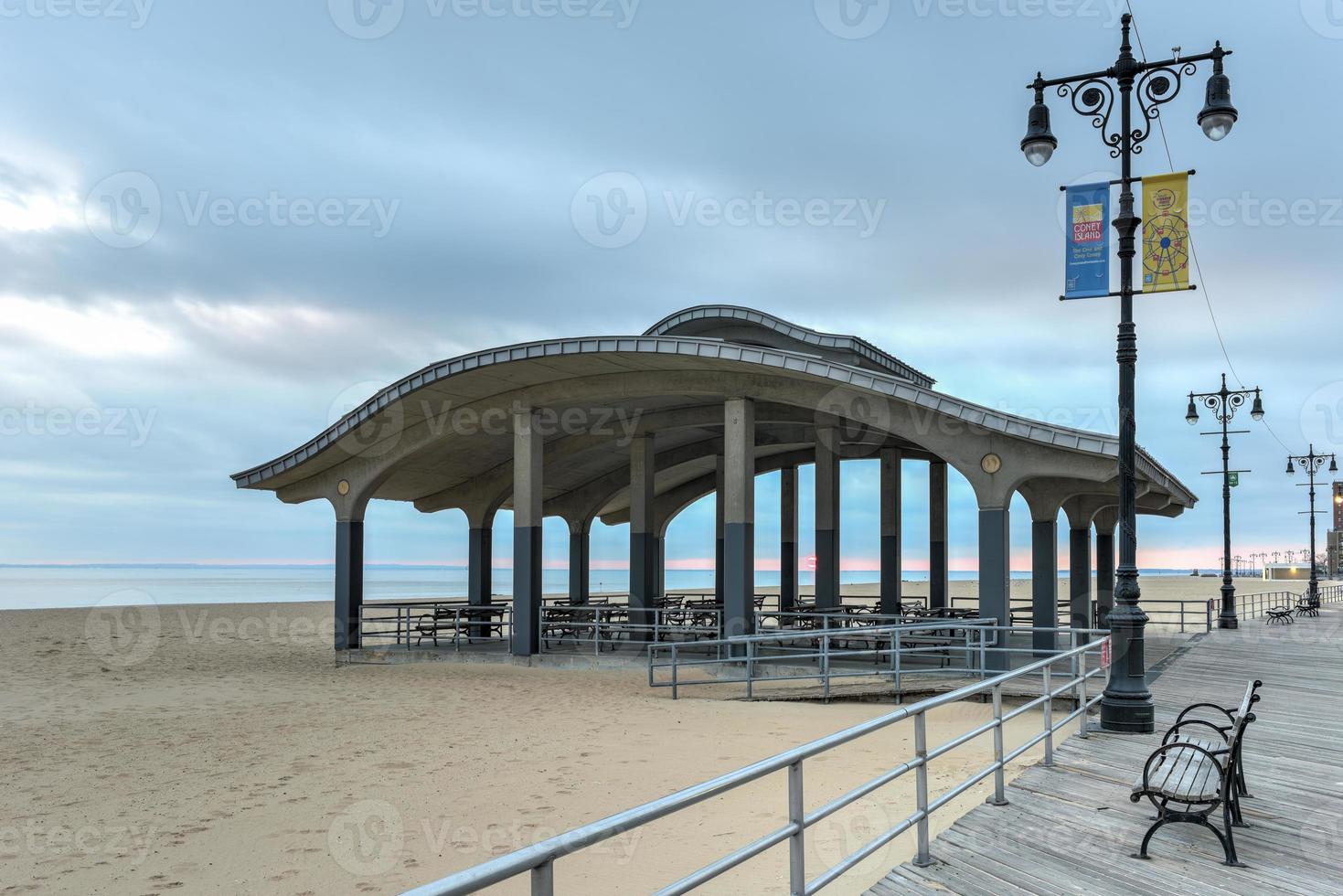 Coney Island boardwalk in Brooklyn, New York at sunset. photo
