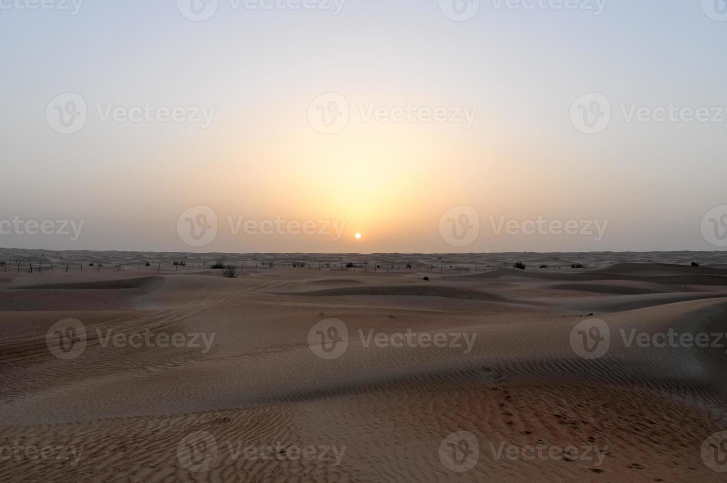 Sunset in Dubai, UAE on a desert safari. photo