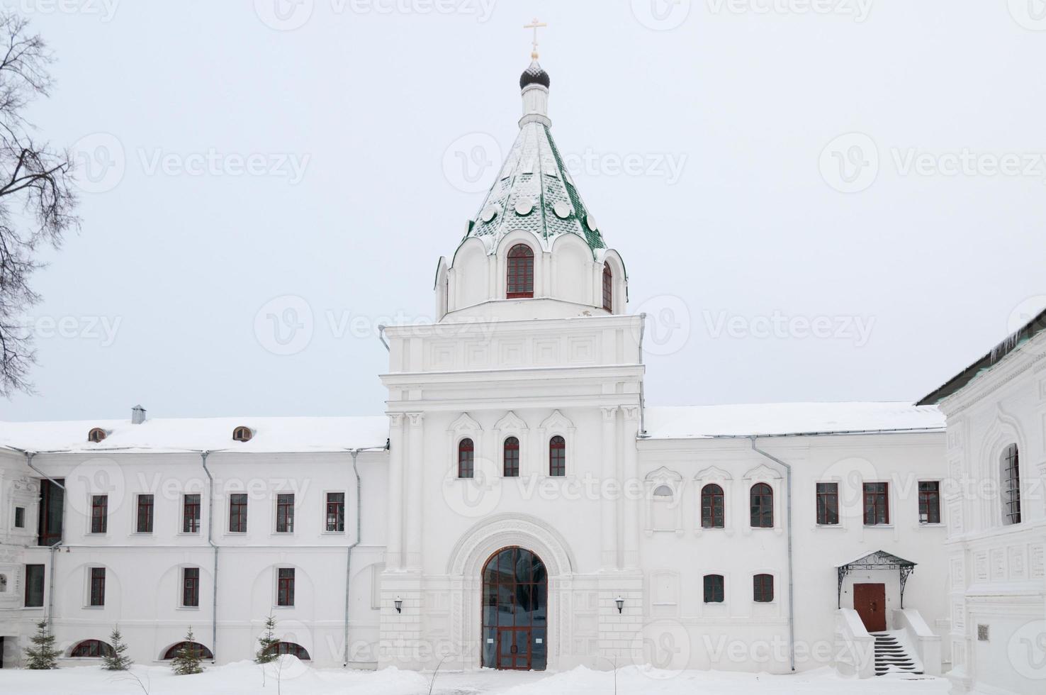 The Ipatiev Monastery, a male monastery, situated on the bank of the Kostroma River just opposite the city of Kostroma, Russia in the winter. photo