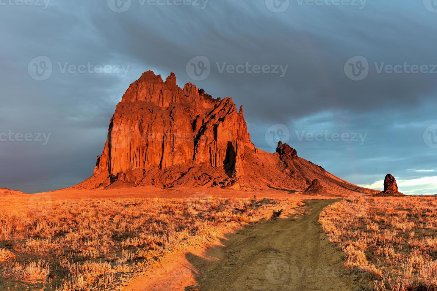 Shiprock is a monadnock rising nearly 1,583 feet above the high-desert plain of the Navajo Nation in San Juan County, New Mexico, United States. photo