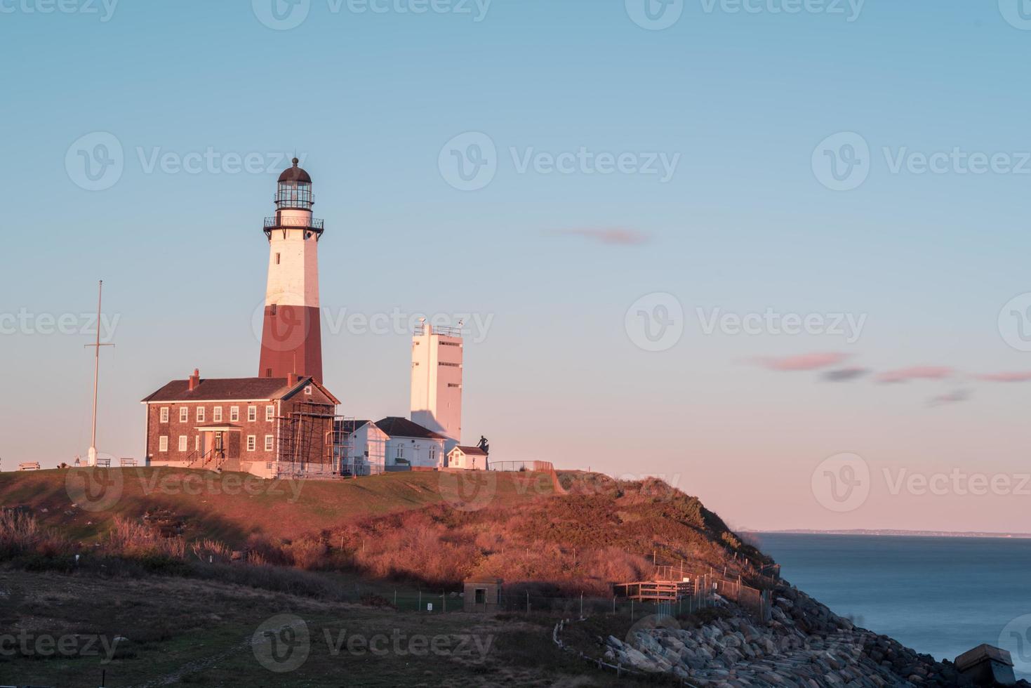 The Montauk Point Lighthouse located adjacent to Montauk Point State Park, at the easternmost point of Long Island, in the hamlet of Montauk in the Town of East Hampton in Suffolk County, New York. photo