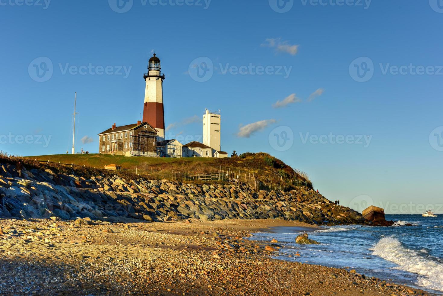 The Montauk Point Lighthouse located adjacent to Montauk Point State Park, at the easternmost point of Long Island, in the hamlet of Montauk in the Town of East Hampton in Suffolk County, New York. photo