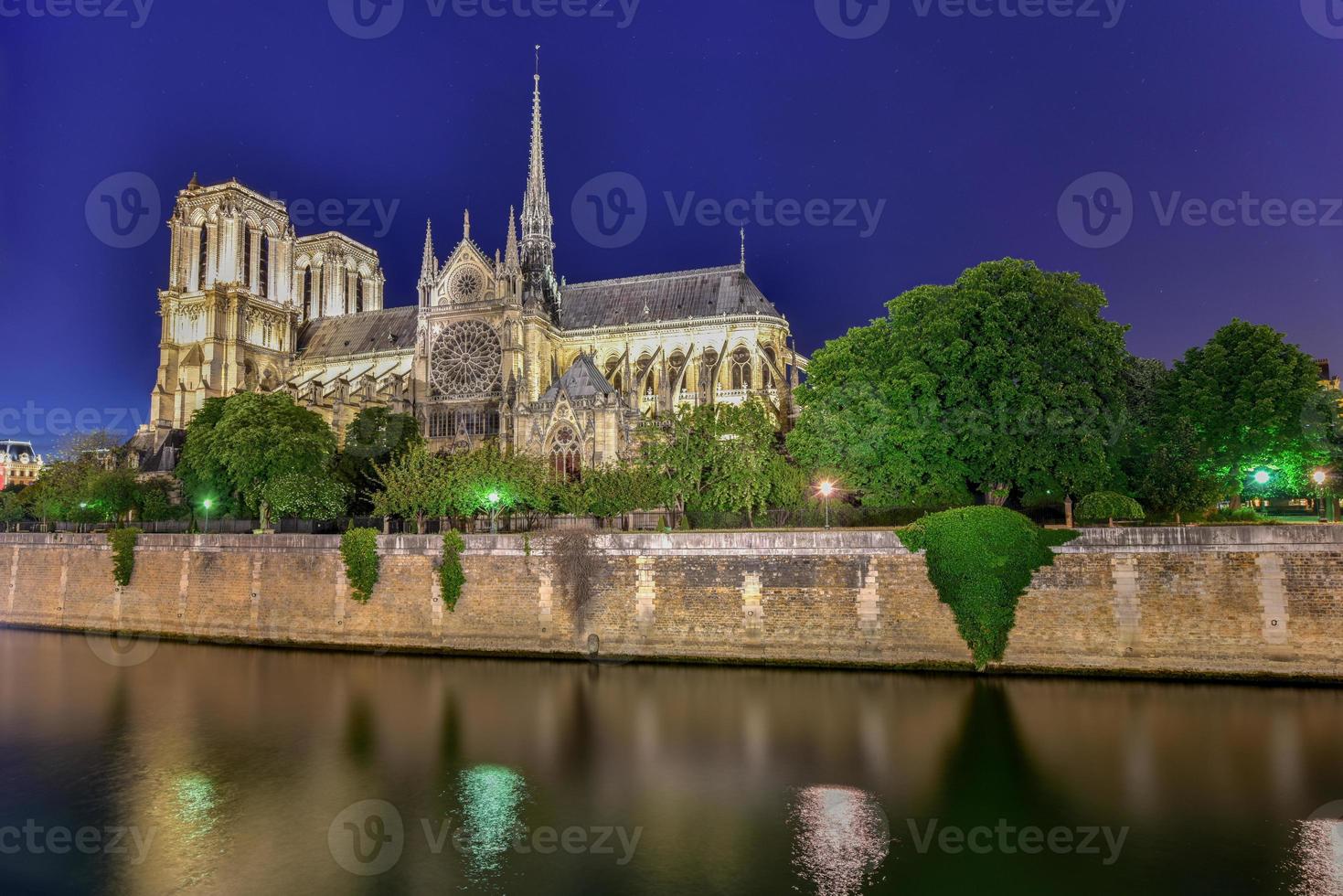 Notre-Dame de Paris Our Lady of Paris, is a French Gothic medieval Catholic cathedral on the Ile de la Cite in the fourth arrondissement of Paris, France. photo