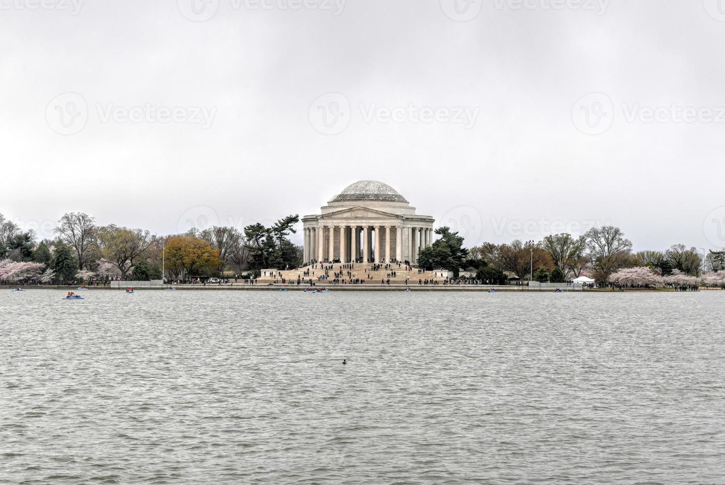 Cherry blossoms at the Tidal Basin and Jefferson Memorial during spring in Washington, DC. photo