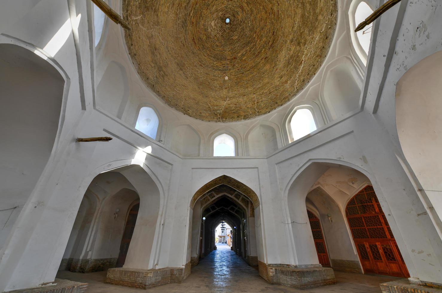 Walkways and streets through the old city of Bukhara in Uzbekistan that keep the air cool even in the hottest of summer days. photo