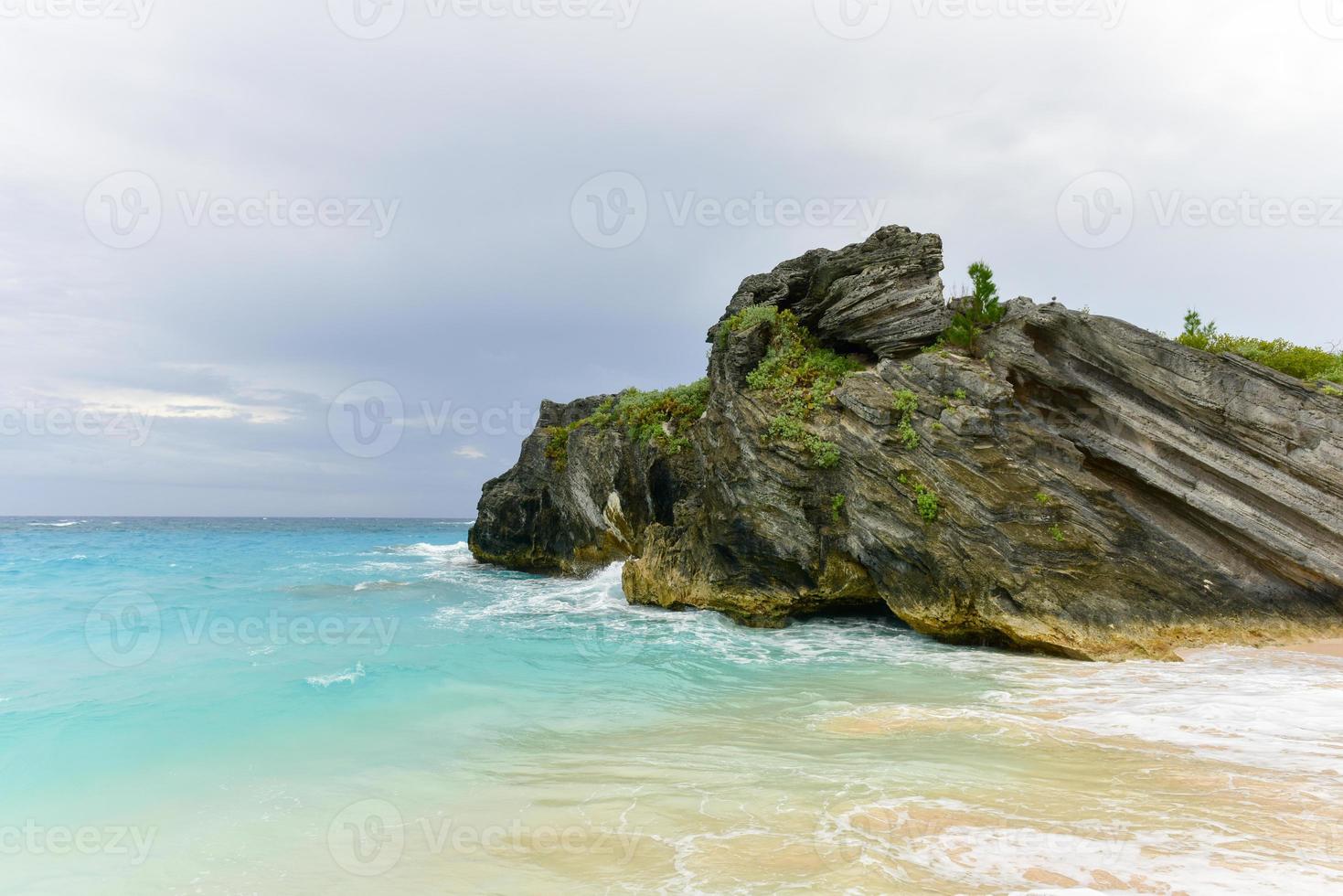 Clear water and pink sand of Jobson Cove Beach in Bermuda. photo