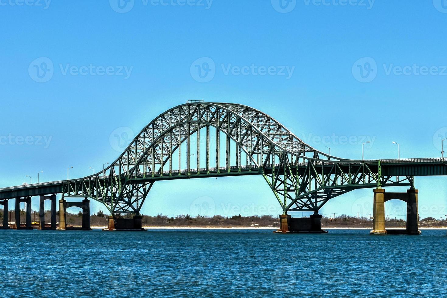 The Fire Island Inlet Bridge, an integral part of the Robert Moses Causeway, is a two-lane, steel arch span with a concrete deck that carries the parkway over Fire Island Inlet. photo