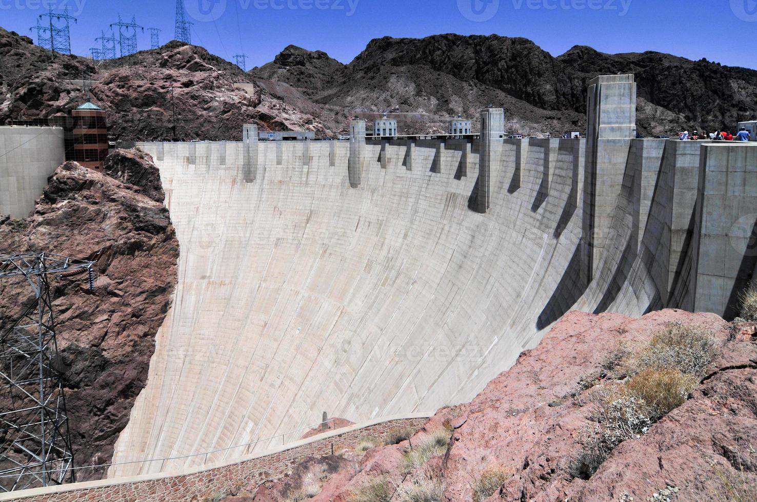 Hoover Dam, originally known as Boulder Dam, a concrete arch-gravity dam in the Black Canyon of the Colorado River, on the border between the U.S. states of Nevada and Arizona. photo