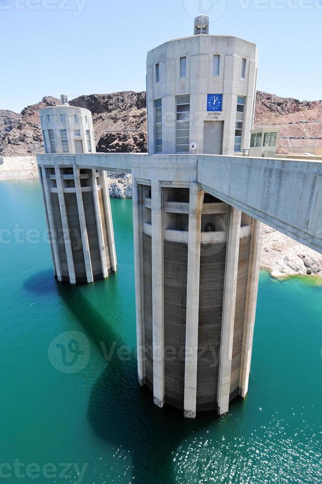 Hoover Dam, originally known as Boulder Dam, a concrete arch-gravity dam in the Black Canyon of the Colorado River, on the border between the U.S. states of Nevada and Arizona. photo