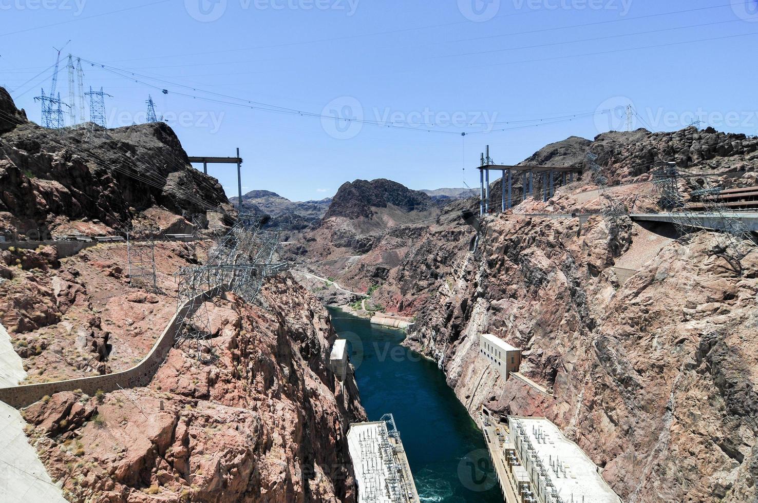 Hoover Dam, originally known as Boulder Dam, a concrete arch-gravity dam in the Black Canyon of the Colorado River, on the border between the U.S. states of Nevada and Arizona. photo