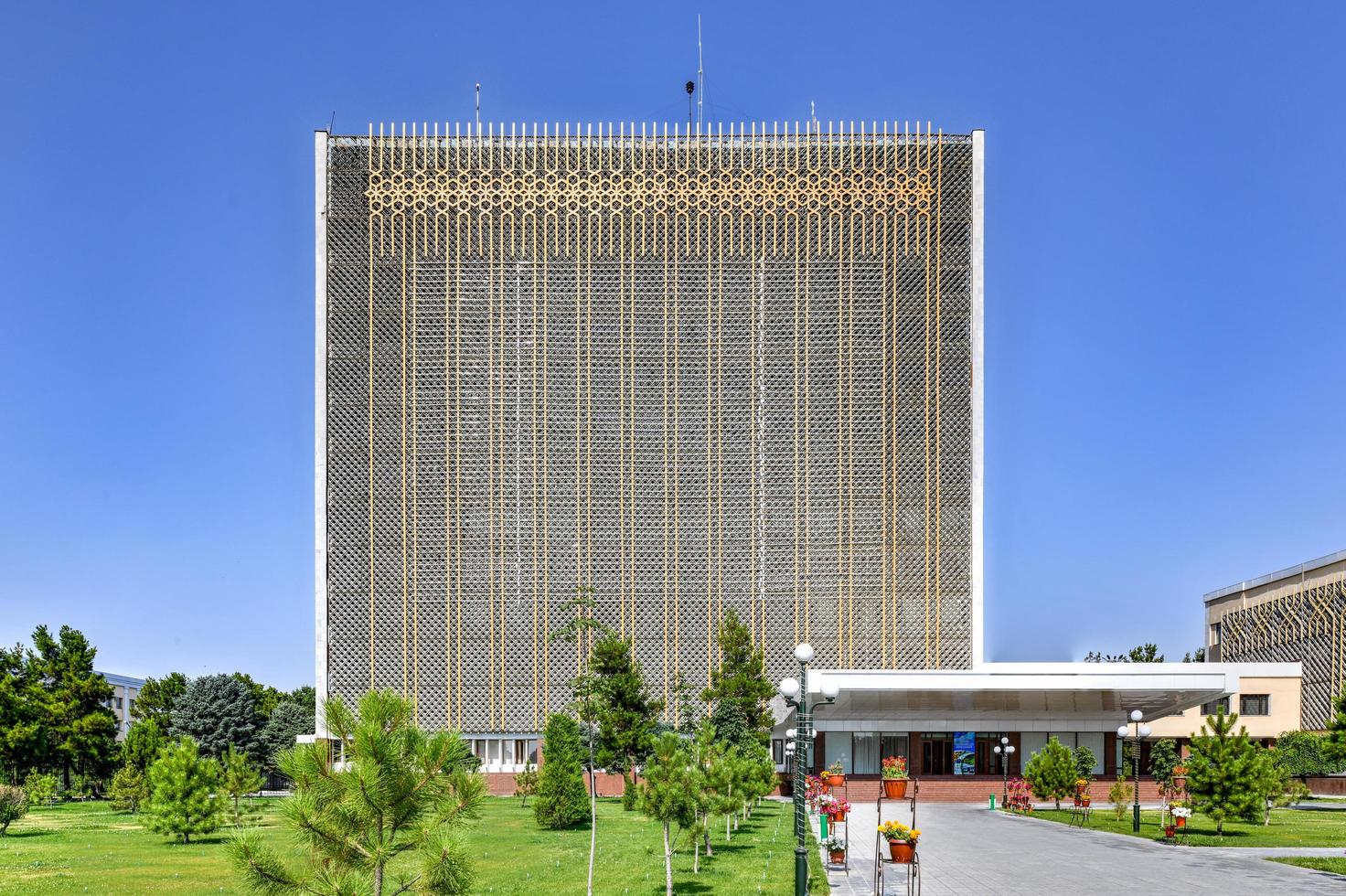 Soviet architecture - tall golden government office building in Samarkand, Uzbekistan, 2022 photo