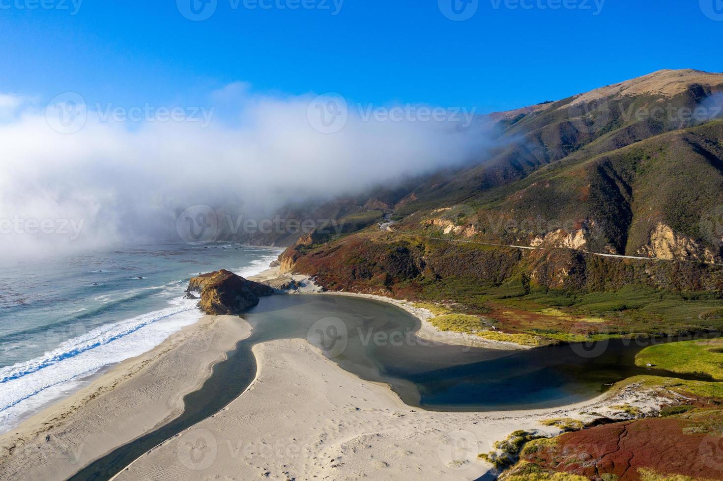 Ocean fog rolling in onto Highway 1 and Big Sur, California, USA photo